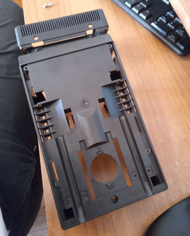 Bottom of MT60, with no screw terminals where they should be but a gaping hole nearby